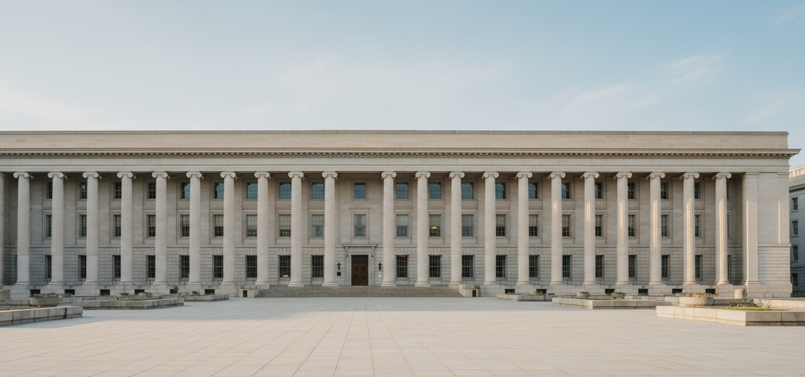 Government administrative building with wide colonnade, Dhaka, morning light